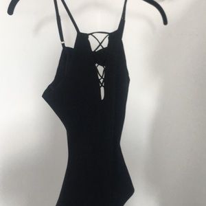 Black backless leotard with tags on